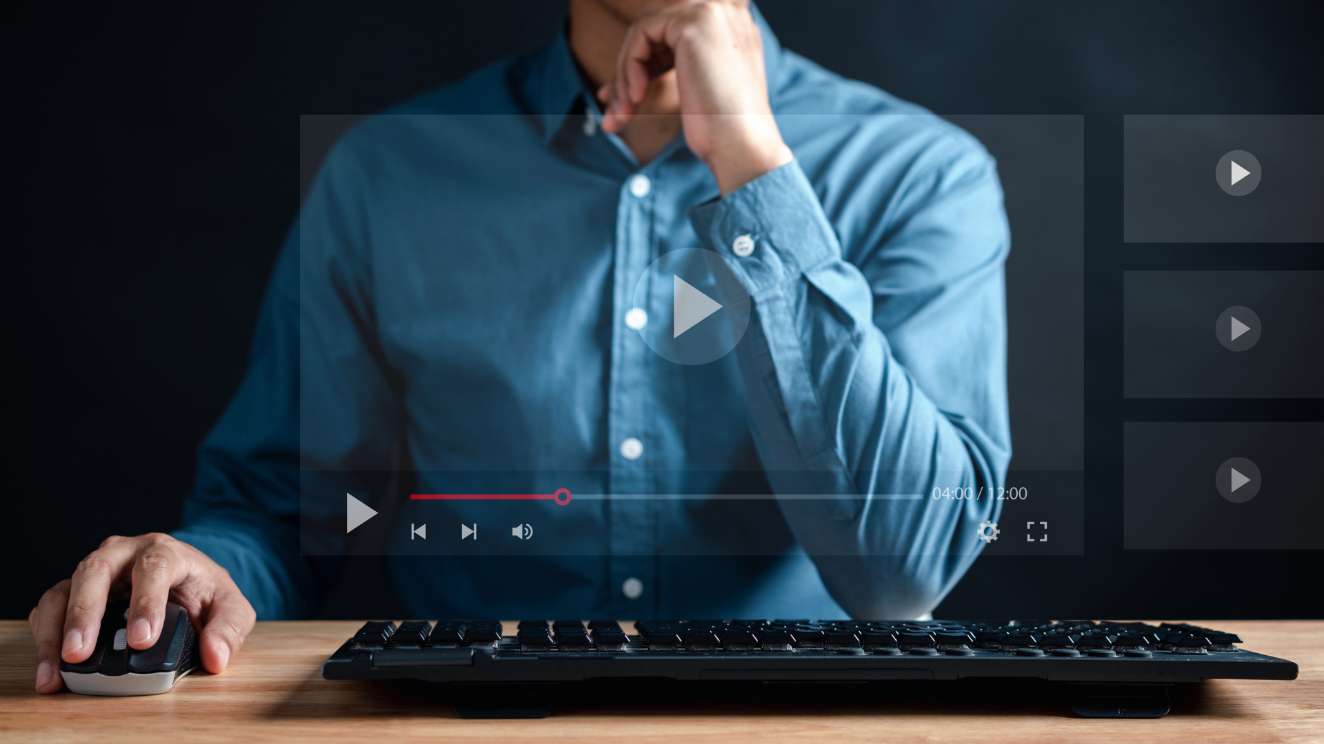 Man sitting at computer doing a video training session.